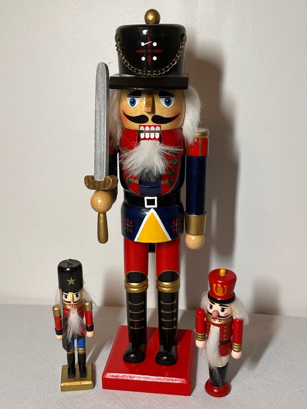 Wooden Nutcracker Soldier 14”. Two smaller ones too. 
Like New